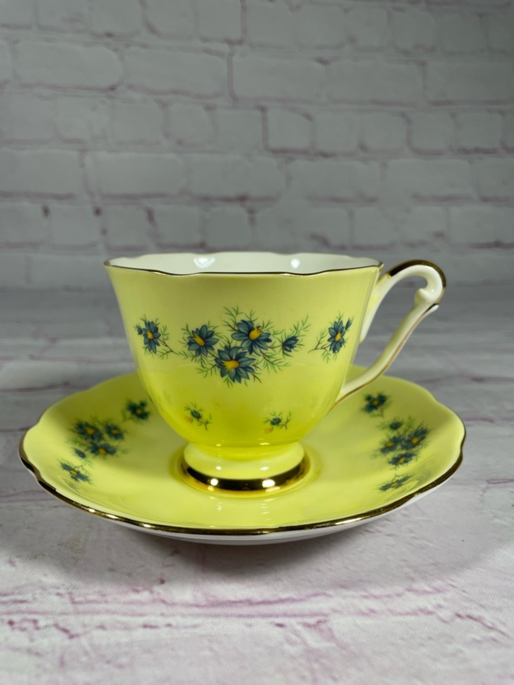 Vintage Yellow and Blue Floral Gold Trim Bone China Footed Teacup and Saucer Set